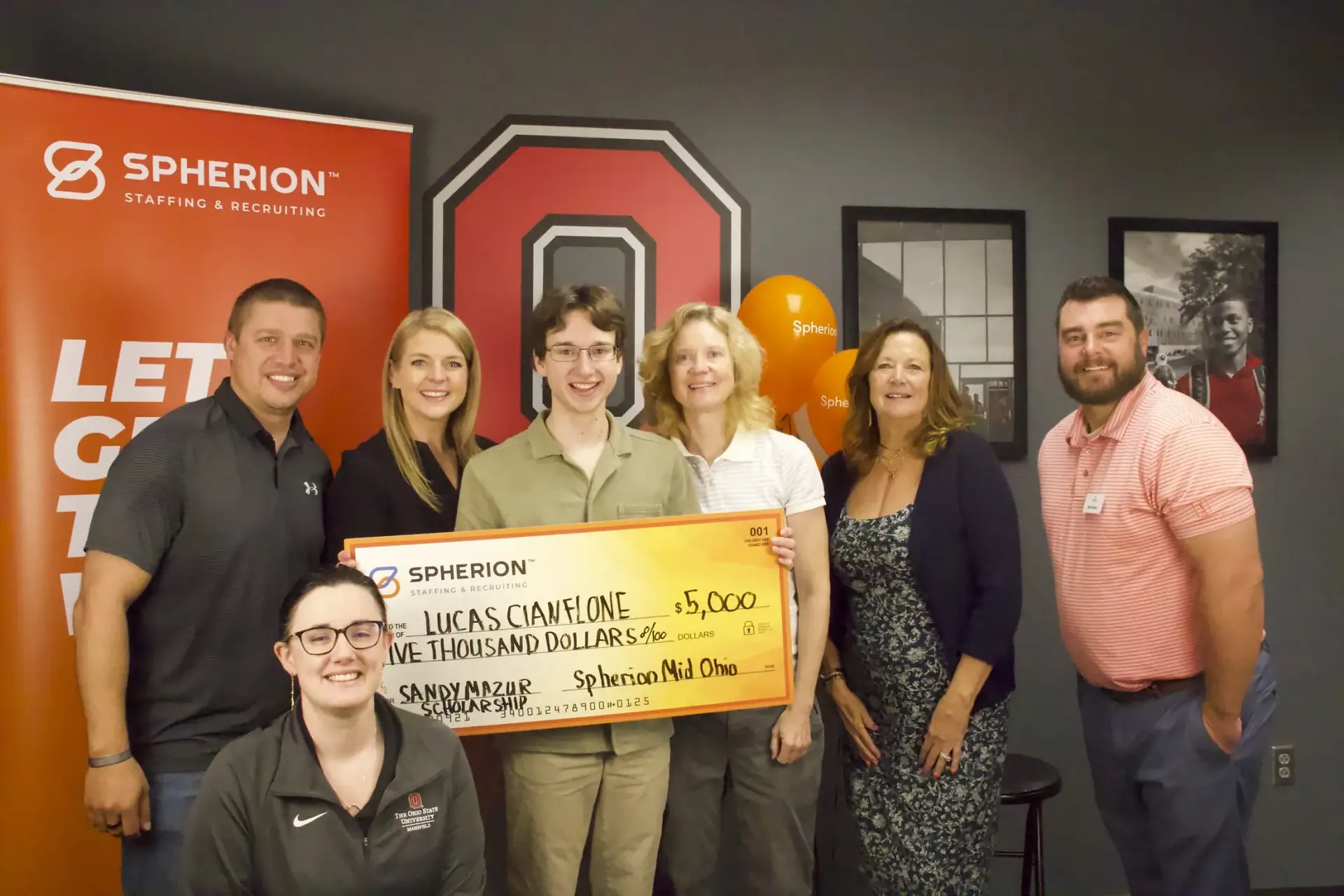 Group holding check for $5,000 for Lucas Chanflone, Spherion Ohio