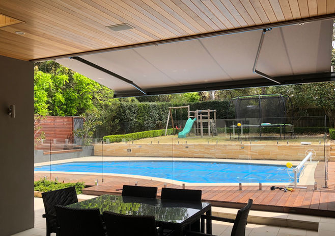 Motorised folding arm awning to shade pool