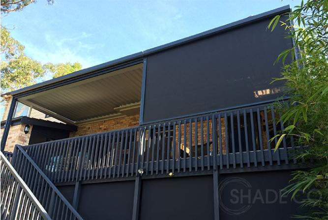 Straight drop awnings installed around a timber deck in Pittwater