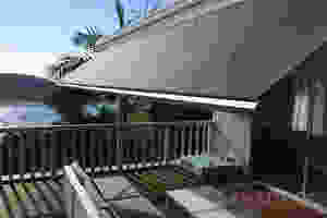 retractable awning shading entertainment area