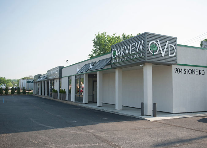 Exterior of an Oakview Dermatology office building with a sign that reads "Oakview OVD Dermatology."