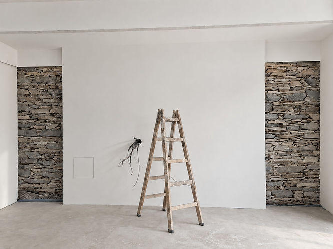 Sanierung eines Hauses im Burgenland, Raum mit Natursteinwand