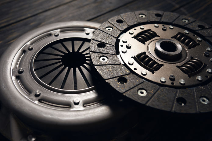 new-car-clutch-kit-dark-wooden-background-close-up.jpg