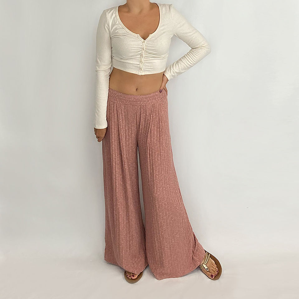 Thumbnail: Model wearing wide legged Palazzo Pants in Mauve with a full view showing the outfit with a cropped top