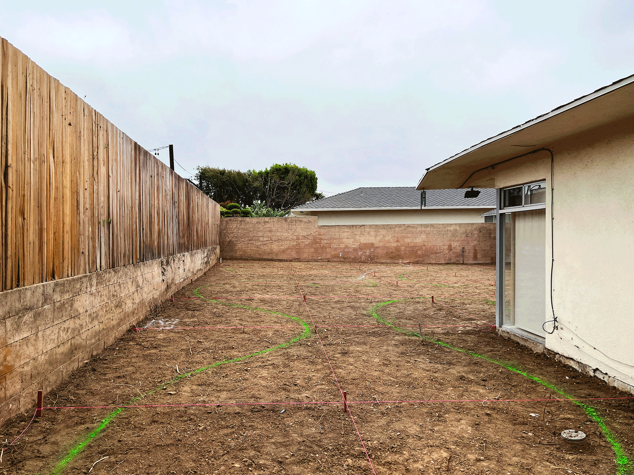 BACKYARD BEFORE AND AFTER LAWN TO DROUGHT TOLERANT PLANTING WITH DECOMPOSED GRANITE CURVED PATHS AND STONE GRAVEL EDGING