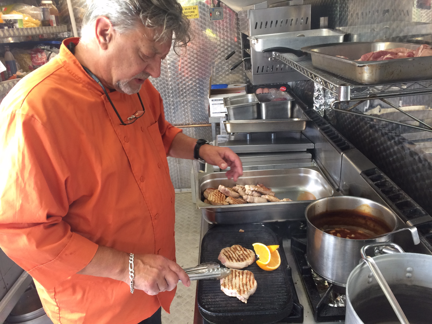 ian preparing food on film location
