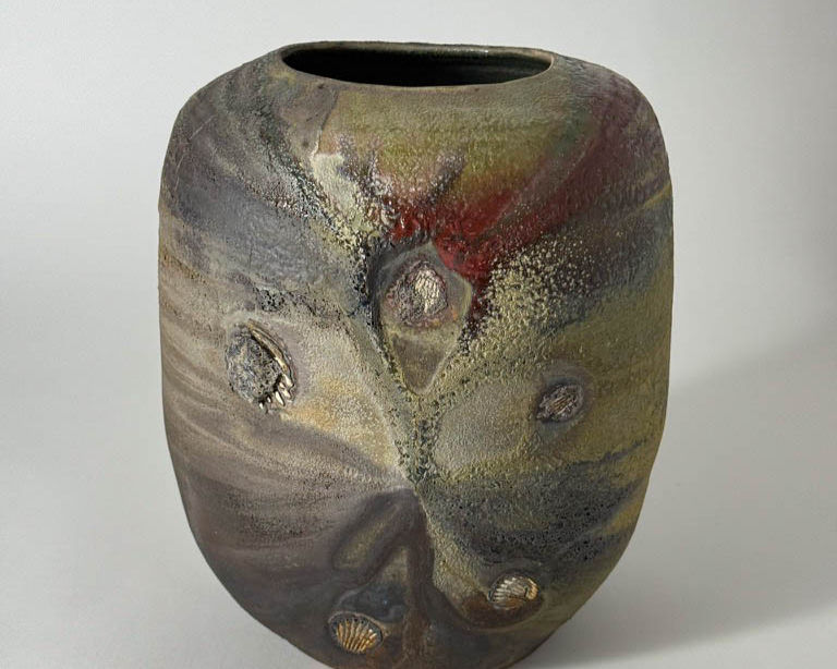 Textured stoneware vase with earthy, mottled glaze