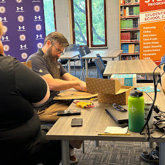 ETP employees practicing our new Makedo tools to include in our engineering module