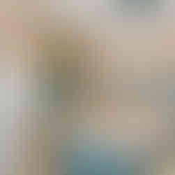 Sunset Beach, NC kitchen with ocean-hued backplash, contrast island and high-end fixtures and appliances.