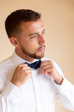 Groom getting ready at Le Ciel Santorini Greece destination wedding groom preparation Denver wedding photography