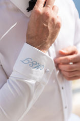Groom getting ready at Love Cave Suites Santorini Greece elopement groom preparation Tom