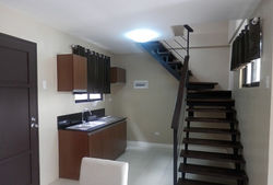 Kitchen Area and Stairways to 2nd Floor