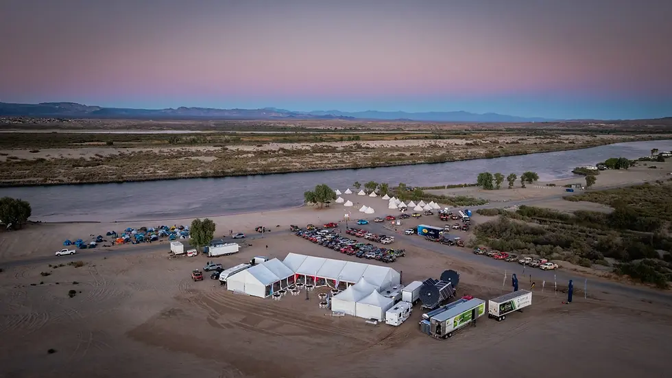Eye-level view of a mobile solar and hydrogen fuel cell microgrid setup in a desert landscape