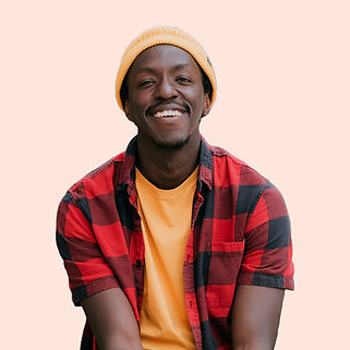 Edgar Lushaju in yellow hat and checked shirt on a peach background