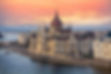 the-hungarian-parliament-on-the-danube-river-at-sunset-in-budapest--hungary-945207010-23af