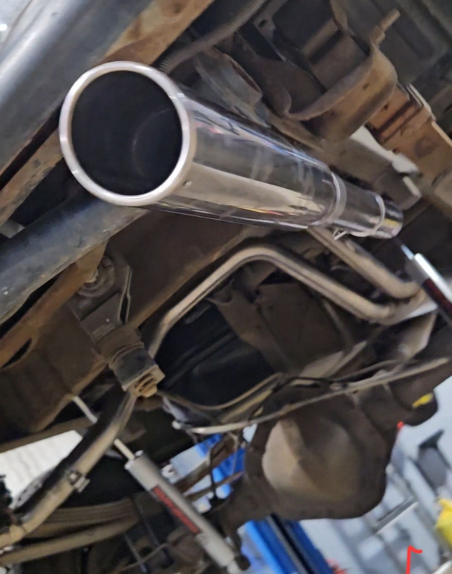 Eye-level view of a 2004 Chevy Silverado with custom exhaust installed