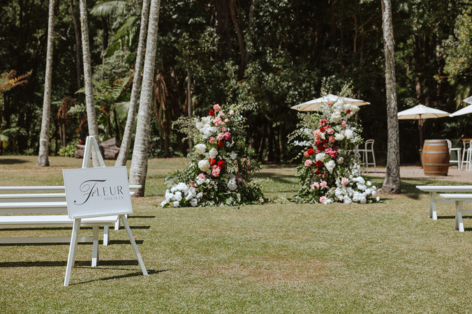 the acre boomerang farm wedding collective gold coast open day ceremony set up with large broken floral arch