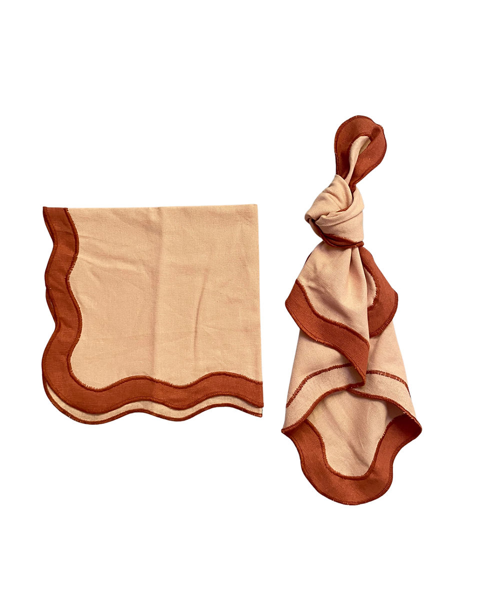 Thumbnail: Tan / terracotta scalloped napkins for hire on the Gold Coast, folded and knotted