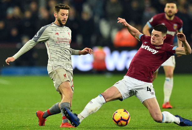 Lallana and Declan Rice vying for the ball. (Image: AFP/Getty Images)