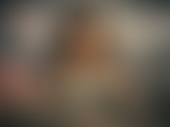 A distressed young woman tears a heart-shaped $100 bill in half, symbolizing a painful emotional and financial separation. Surrounded by a broken piggy bank, overdue bills, foreclosure notices, and heavy chains, the image powerfully illustrates the weight of limiting beliefs about money and their impact on personal freedom and stability.