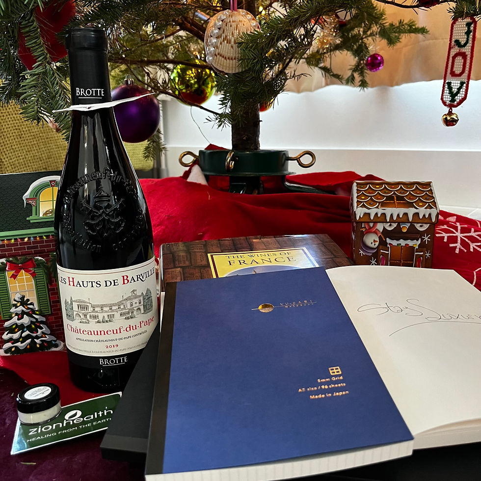 curated luxury items under a christmas tree