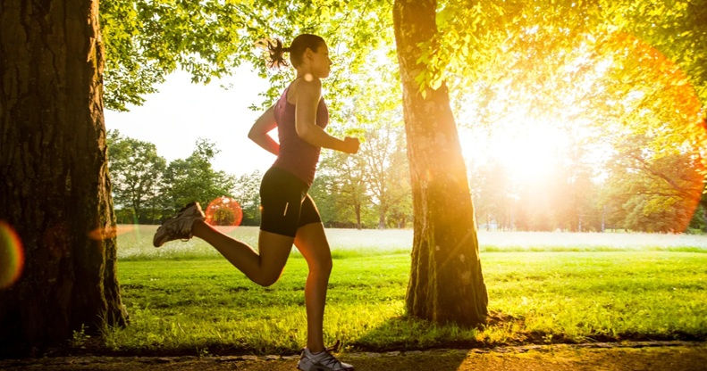 woman running on a trail in the Spring