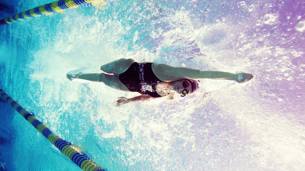 athlete swimming with overhead arm movement