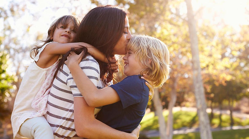 mom with low back pain at home with young children