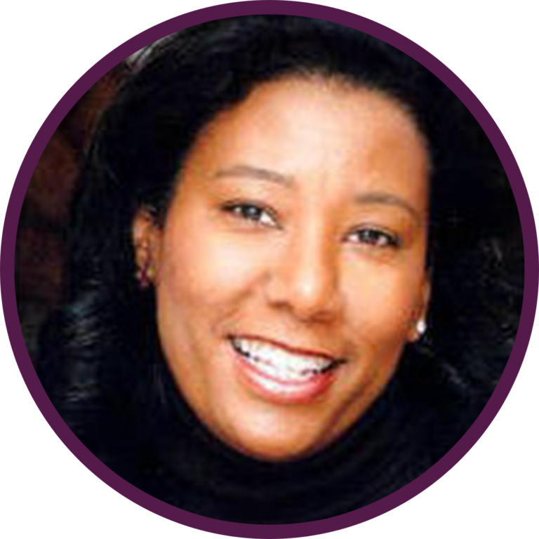 Portrait of Marla Higginbotham, professional headshot, warm neutral background, vertical portrait