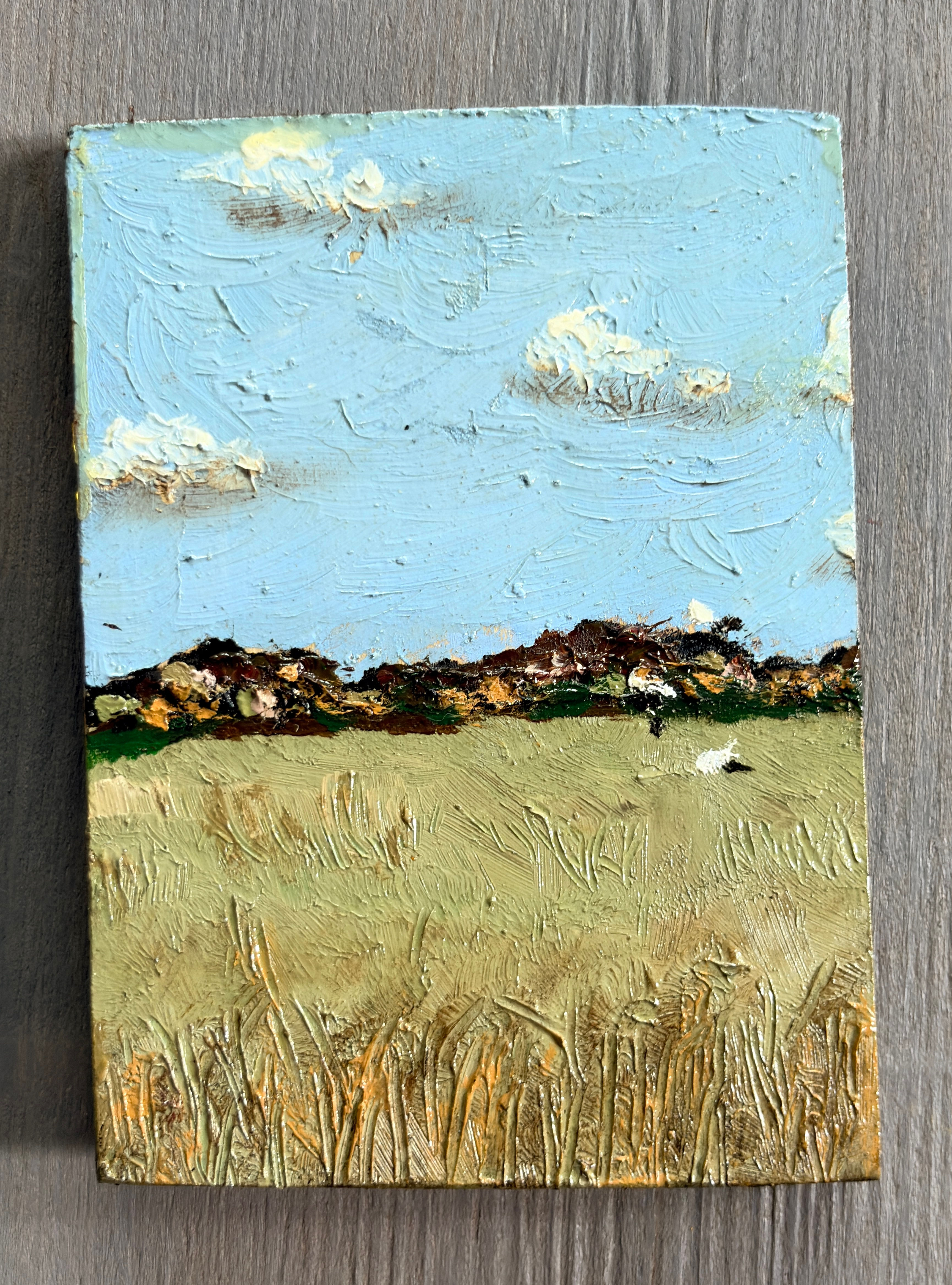Miniature oil painting on a wooden board
