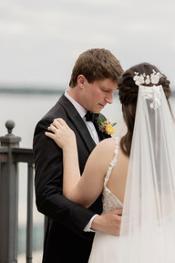 Bride and Groom First Look with view of Lake Monona from the rooftop terrace at The Madison Club, a Madison Wisconsin Wedding Venue