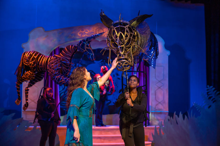 Woman touching a Dragon Puppet