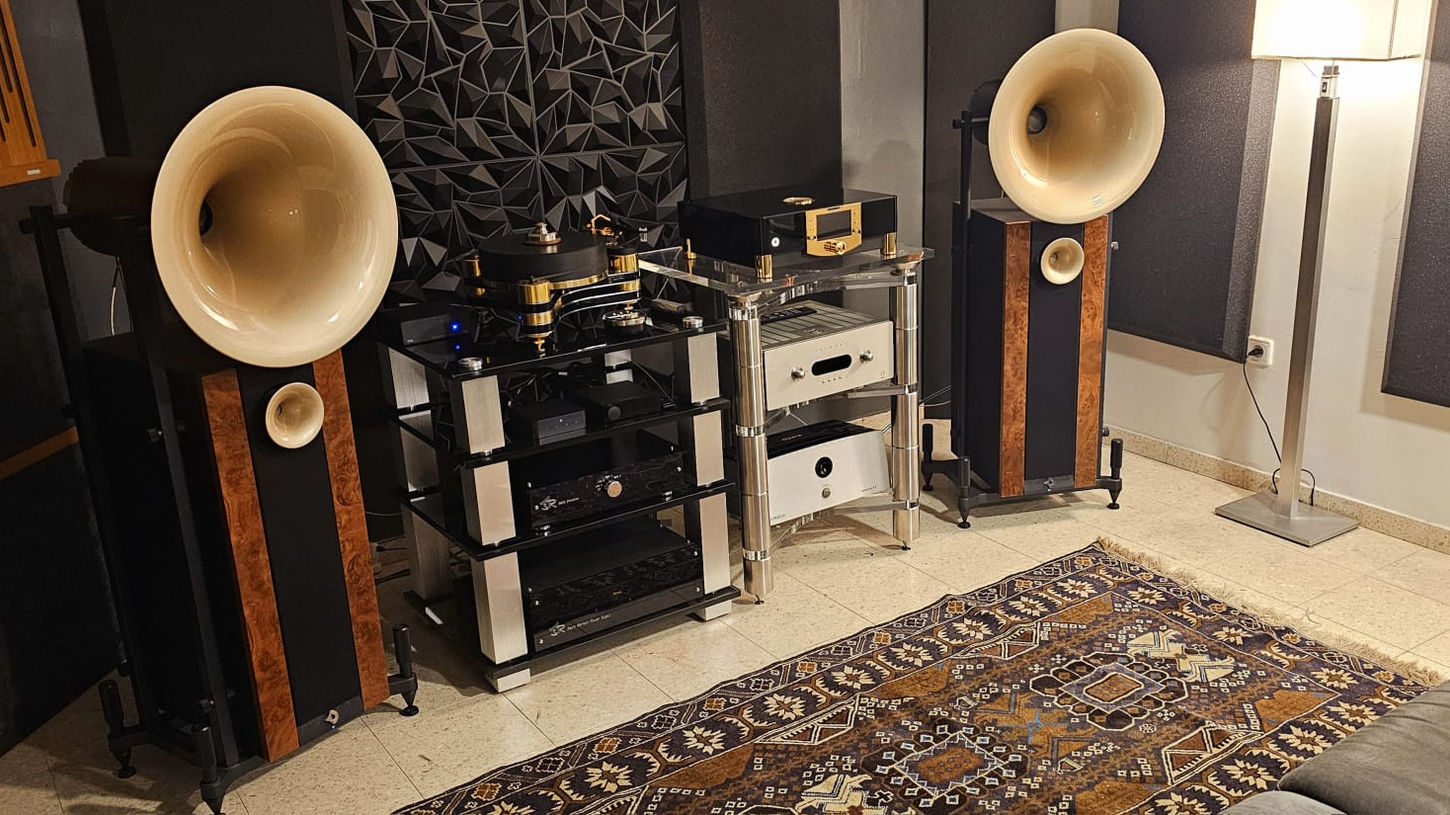 High-end audio system setup with large speakers