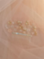 Thumbnail: Elegant pearl and gold Pearl Blossom Hair Comb on a pink veil background