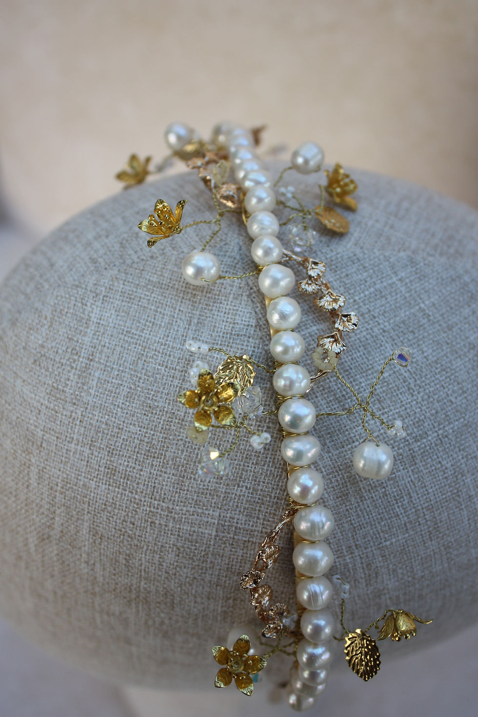 Thumbnail: Elegant Golden Flowers Tiara with pearls and details embellishing a headpiece