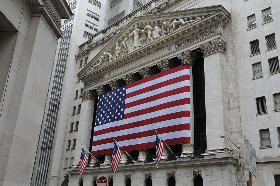 Eye-level view of a modern stock exchange building with a clear sky