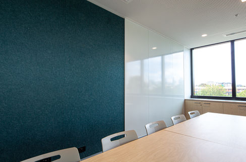 Wurun Senior Campus meeting space featuring blue acoustic panels paired with gloss whiteboards. installed by BACH Commercial.