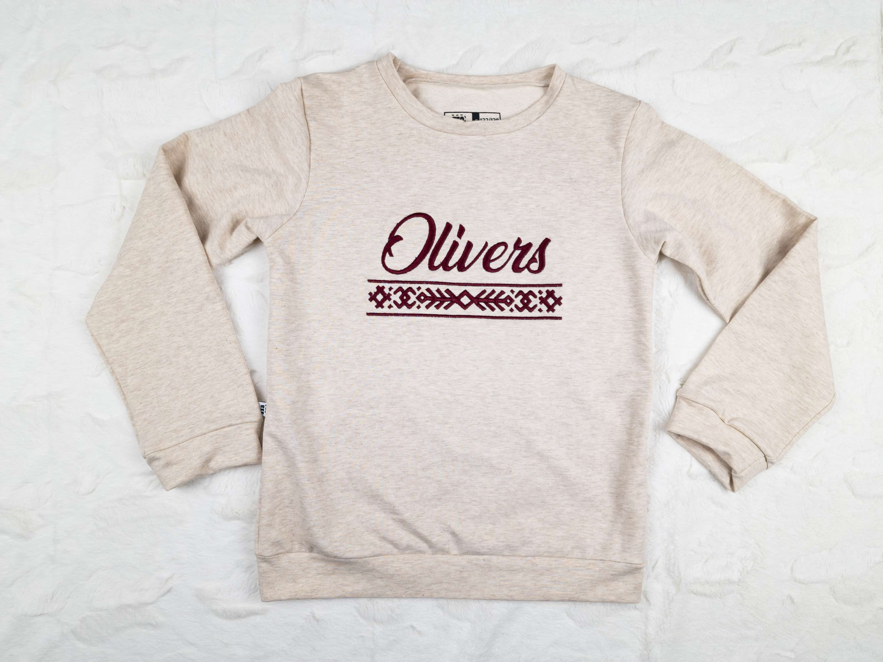 Sweatshirt with a Latvian ornament band and the child's name