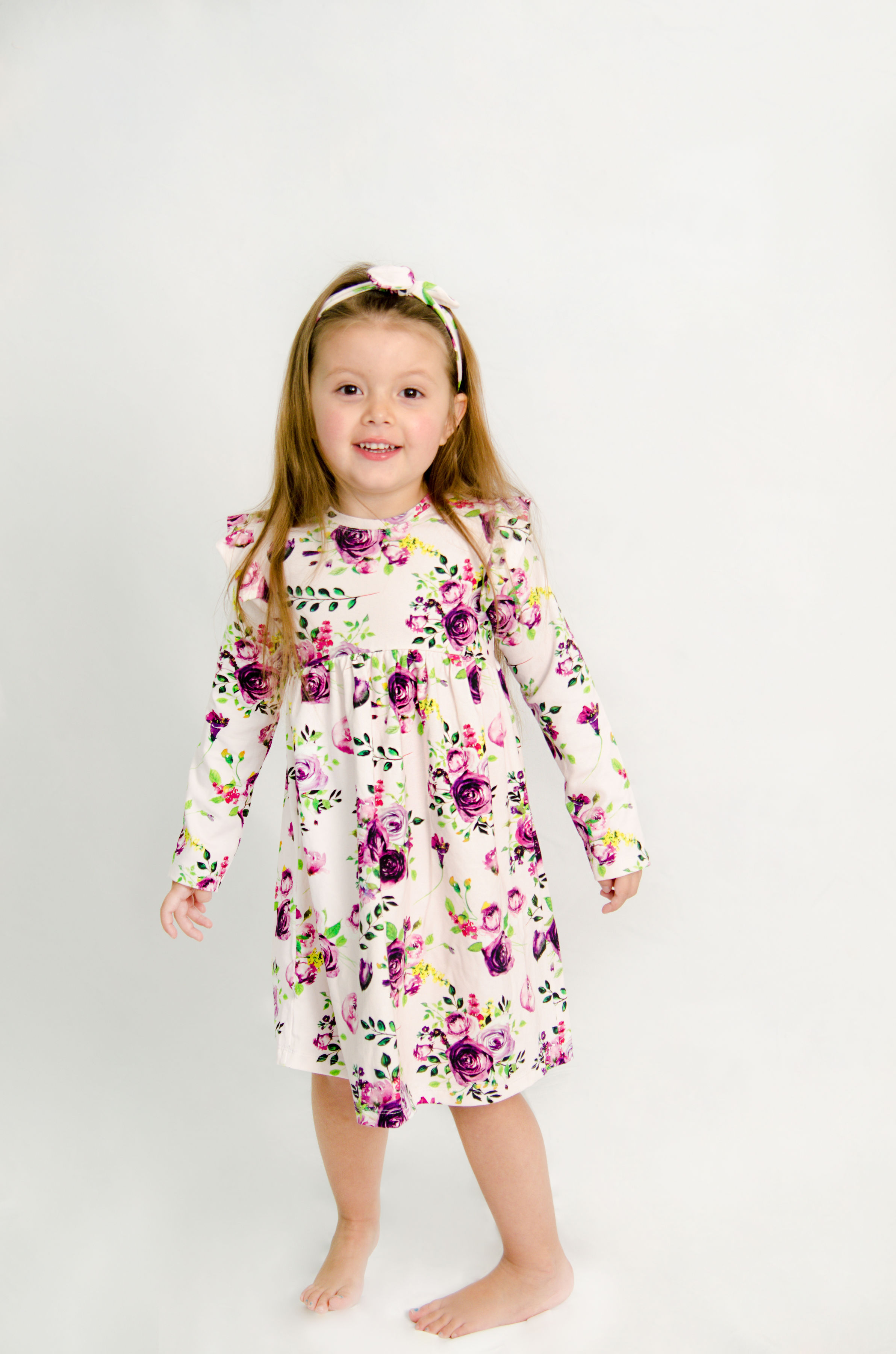 Purple rose pattern dress with long sleeves and ruffles on shoulders