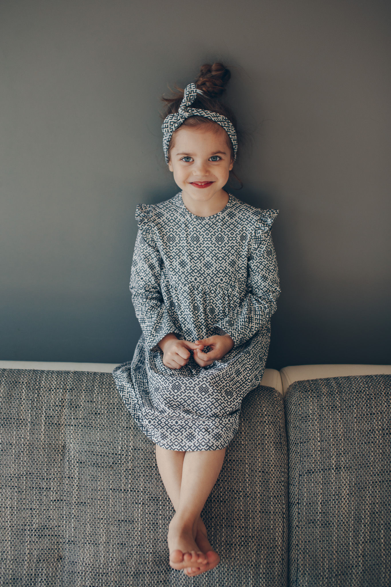 Latvian design dress with long sleeves and ruffles on shoulders