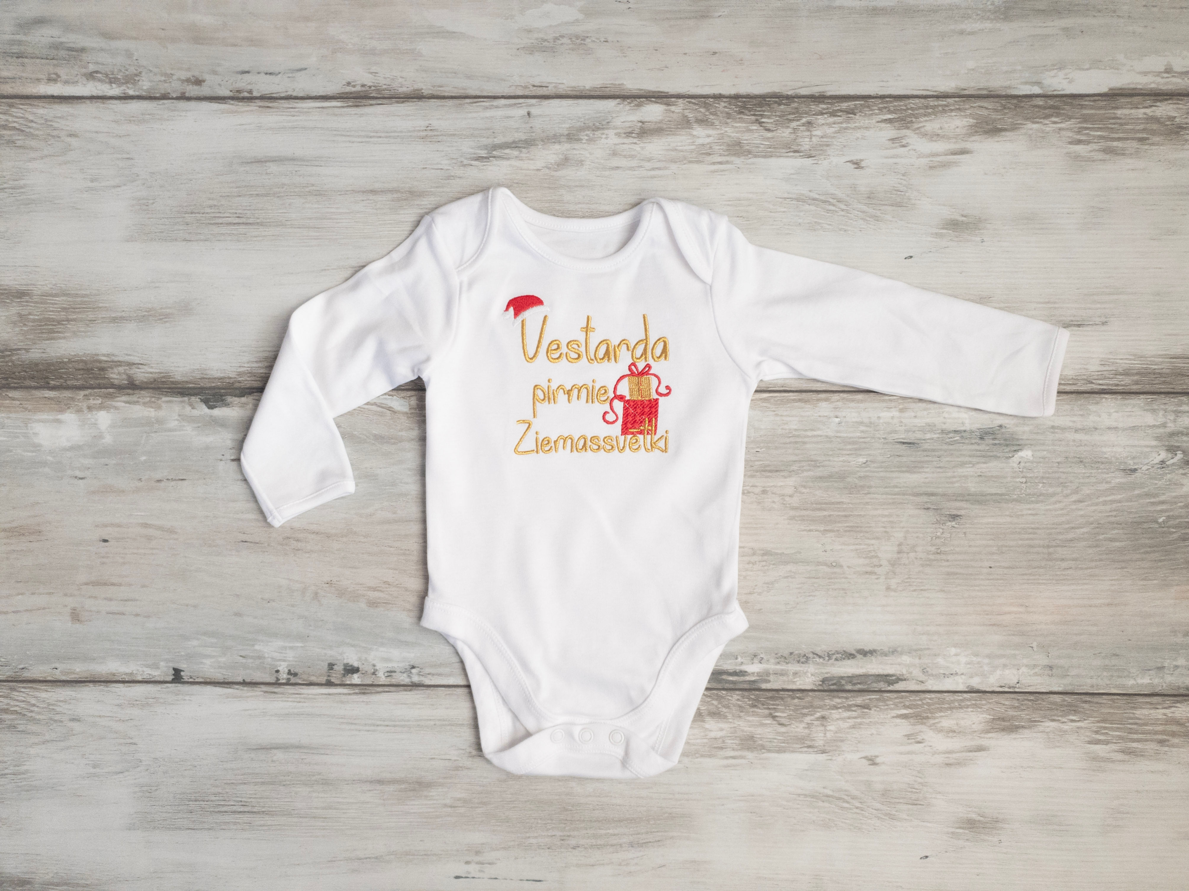 Personalized bodysuit with child's name, a gift and "... pirmie Ziemassvētki"