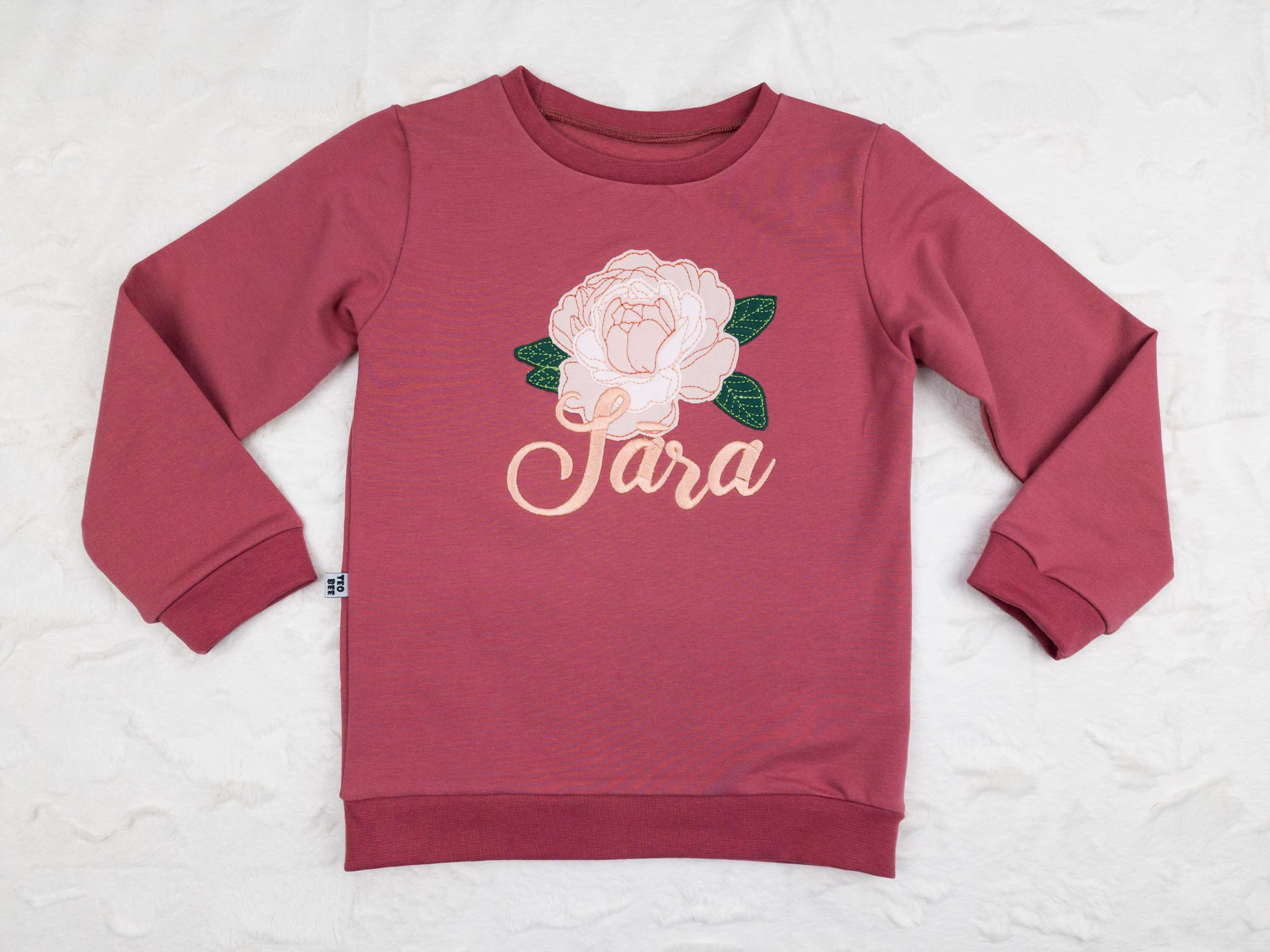 Pieaugušo džemperis ar Peonijas zieda aplikāciju