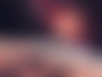 Alien landscape with rocky terrain under a starry sky. A bright galaxy and planets hover above, creating a cosmic and mysterious atmosphere.