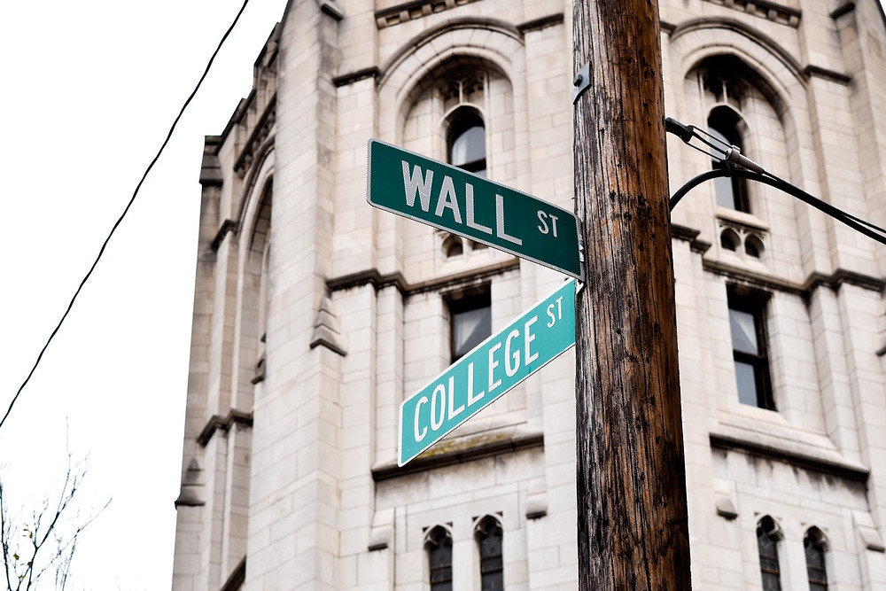 <img src="wallst.jpg" alt="street sign of wall street and college street in new york city">