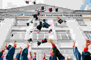 <img src="graduationcaps.jpg" alt="graduates throwing graduation caps up into the air">