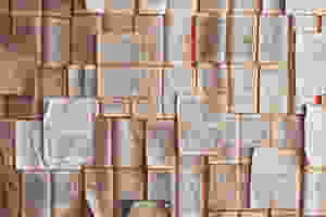 <img src="books.jpg" alt="open books scattered and pinned across a wall in different directions">