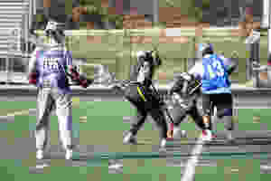 <img src="sports.jpg" alt="boys playing lacrosse on field">