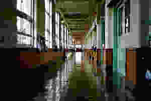 <img src="hallway.jpg" alt="school hallway with backpacks and bags hung by the windows and doors">