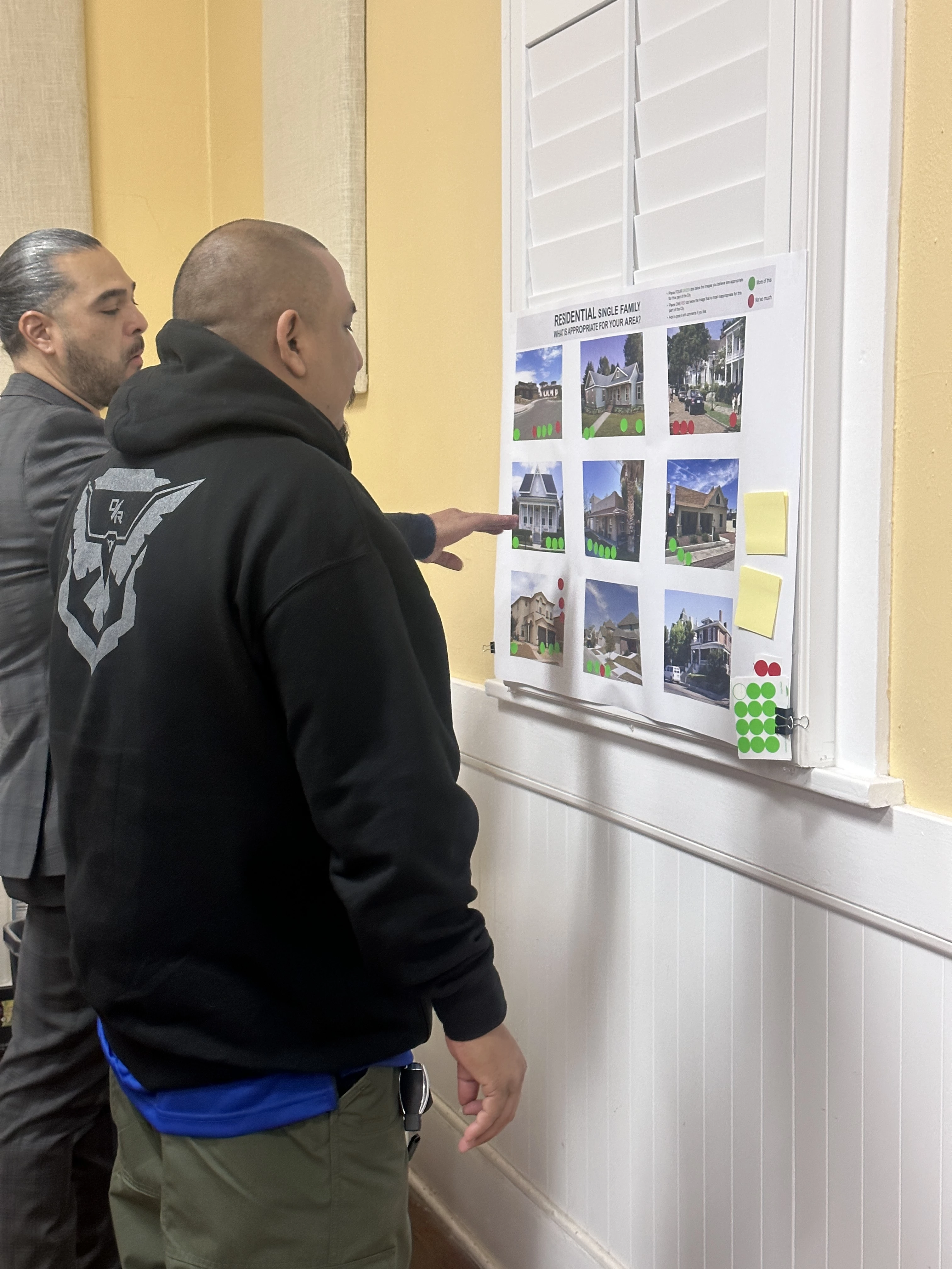 Attendees reviewing zoning maps and development plans at the Socorro UDC Open House.