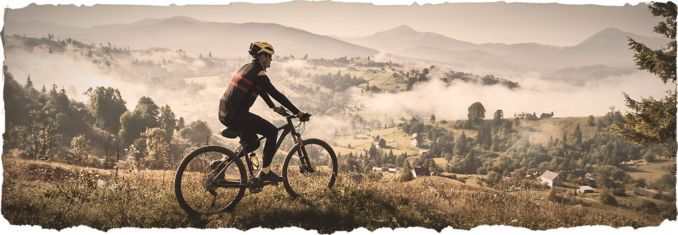 cyclist over valley.png